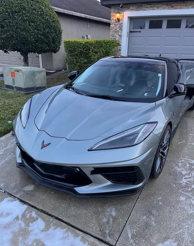 Silver Corvette C8 freshly detailed inside and out in a driveway
