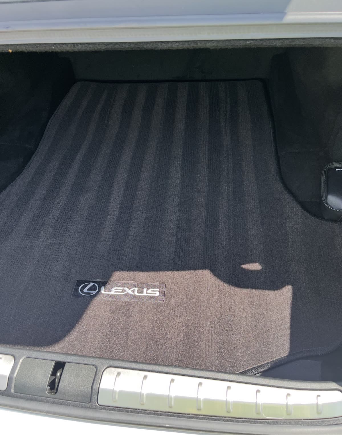 Vacuumed Lexus trunk with clean OEM mats